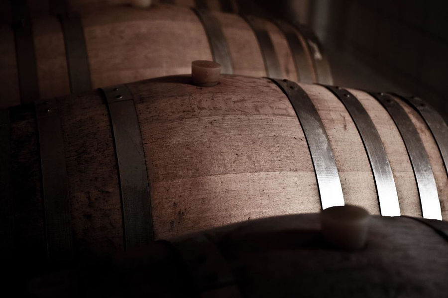 three wood barrels with bungs at 'Ktima Karipidis' cellar